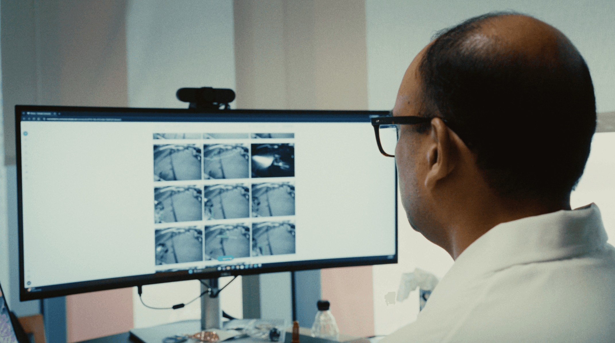 Sameer looking at footage